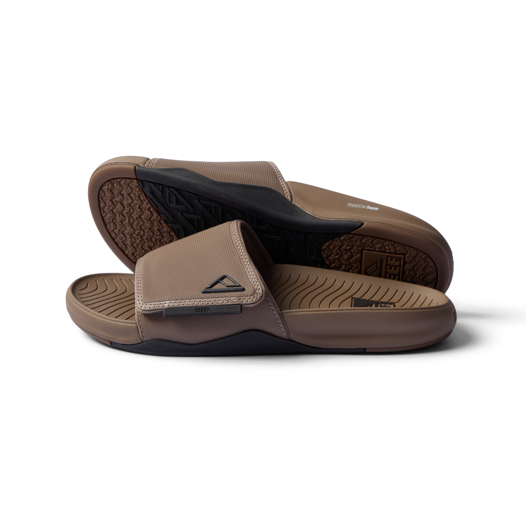 Phantom Slab men’s sandals in fossil black facing right showing footbed and top strap close-up, beach-inspired comfort footwear.