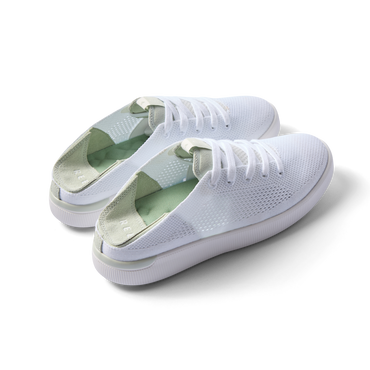Pair of Reef Neptune shoes facing right, featuring white and dusty sage colors, knit material, and cushioned arch support.