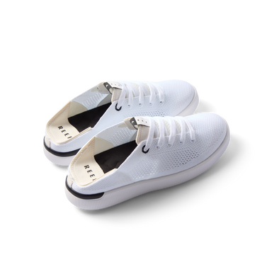 Reef Neptune women's white and black sneakers facing left, featuring breathable knit upper and cushioned sole for all-day comfort.