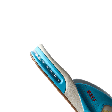 Fanning men's aqua blue sneaker facing left, showing side profile with cushioned arch support and water-friendly design.