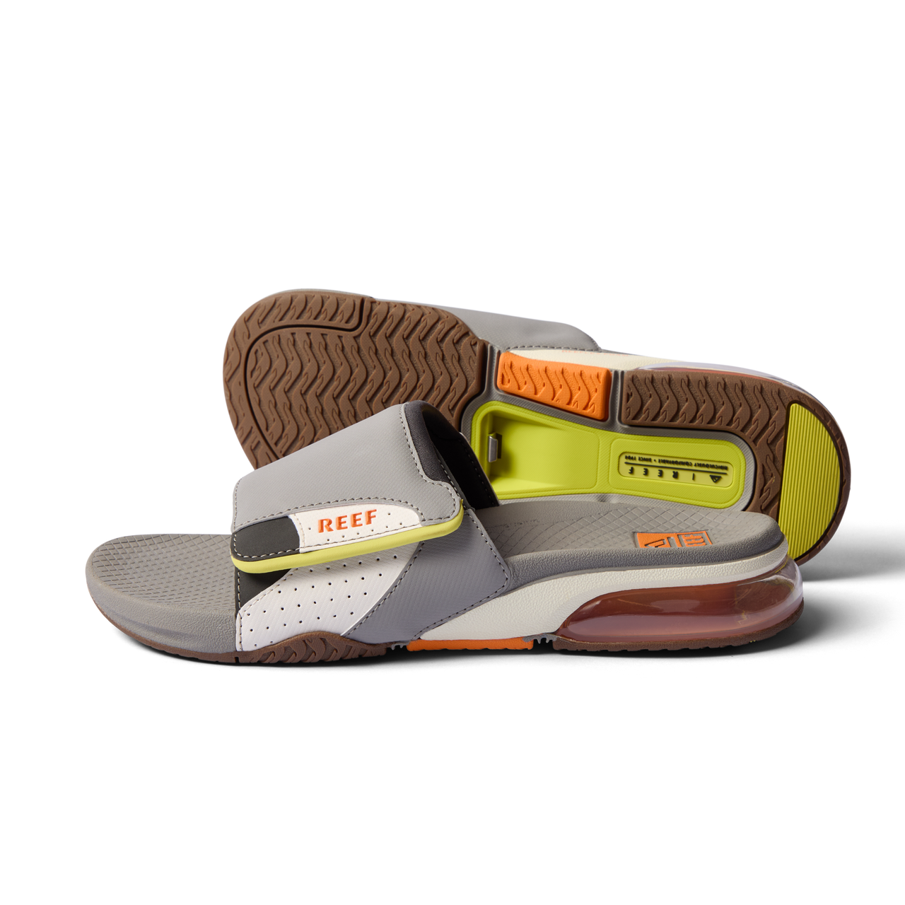 Pair of Fanning + Slide men's grey water-friendly slides facing left showing sole and adjustable strap with arch support cushioning