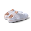 Reef Neptune women's white blush sneakers facing right, showing heel and side with breathable knit upper and cushioned sole.