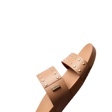 Cushion Vista women's sandal facing right, close-up on soft leather straps with metal studs and arch support design.