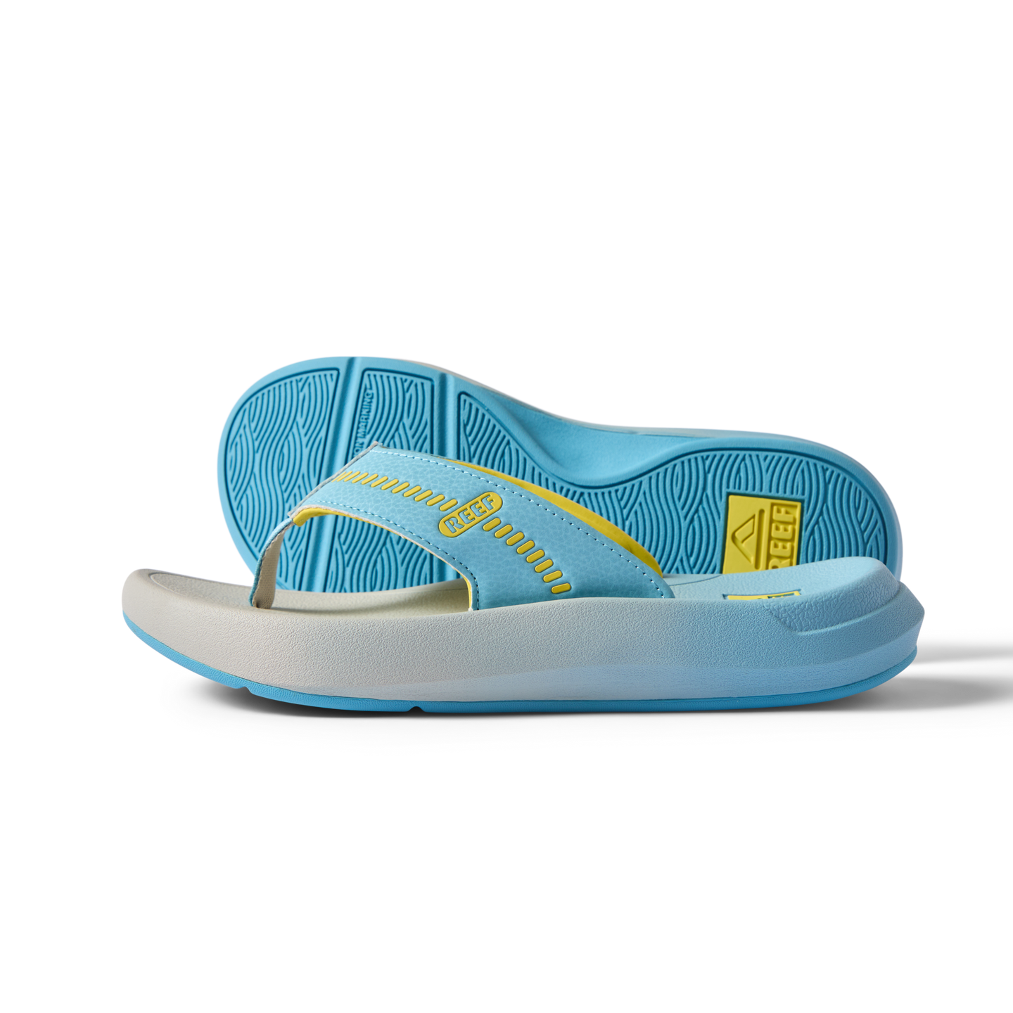 Cruiser men's flip flop sandal facing right with a close-up of the sole, light blue and yellow, surf-inspired comfort