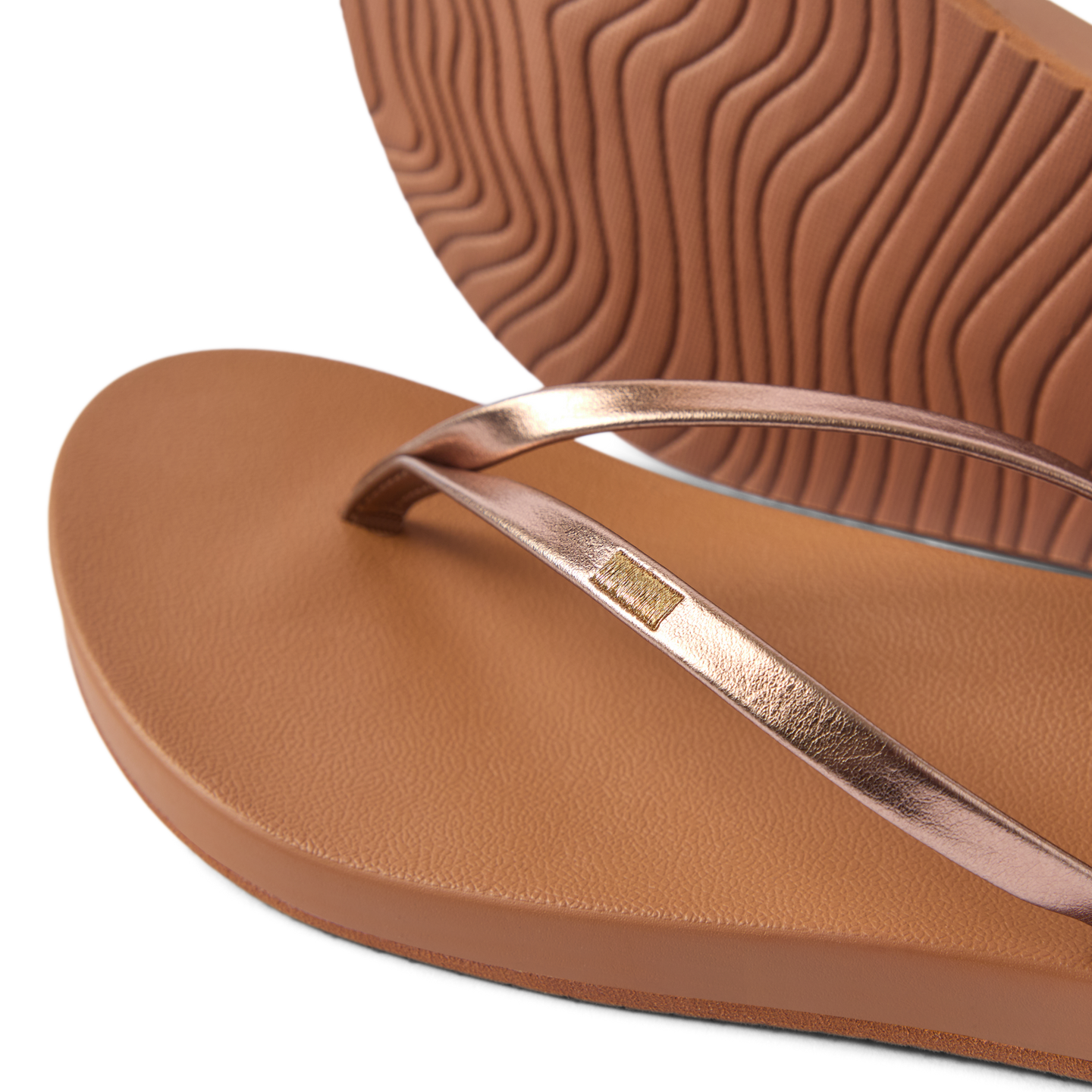 Close-up of Cushion Slim women's sandal facing left with bronze straps, showing soft cushioning and textured sole for comfort.