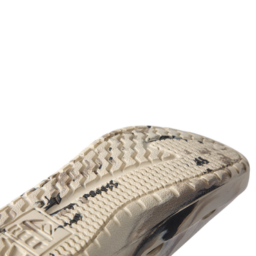 Glider close-up of the outsole facing right, showing textured traction and cushioned sole