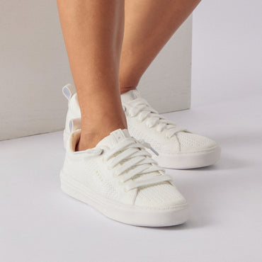 Lay Day Lite women's white sneakers facing forward, close-up on lightweight, cushioned knit upper with arch support.