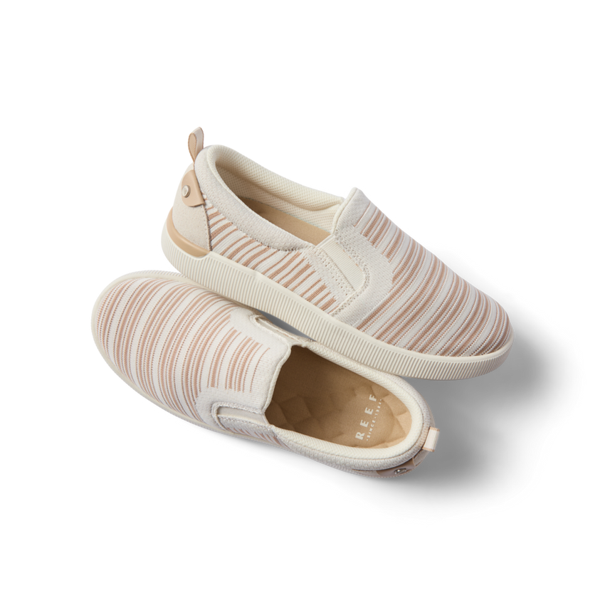 Pair of Neptune Elyse women's slip-on shoes with tan stripe pattern, right shoe facing right, top shoe showing outsole, comfort-focused design.