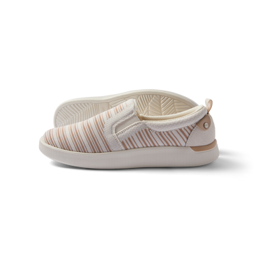 Neptune Elyse women's slip-on sneaker facing left, close-up side view with soft cushioning and arch support, beach-inspired design.
