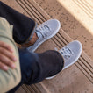 Neptune HT facing forward on feet wearing dark jeans, men's grey water-friendly sneaker with REEFlex cushioning and arch support