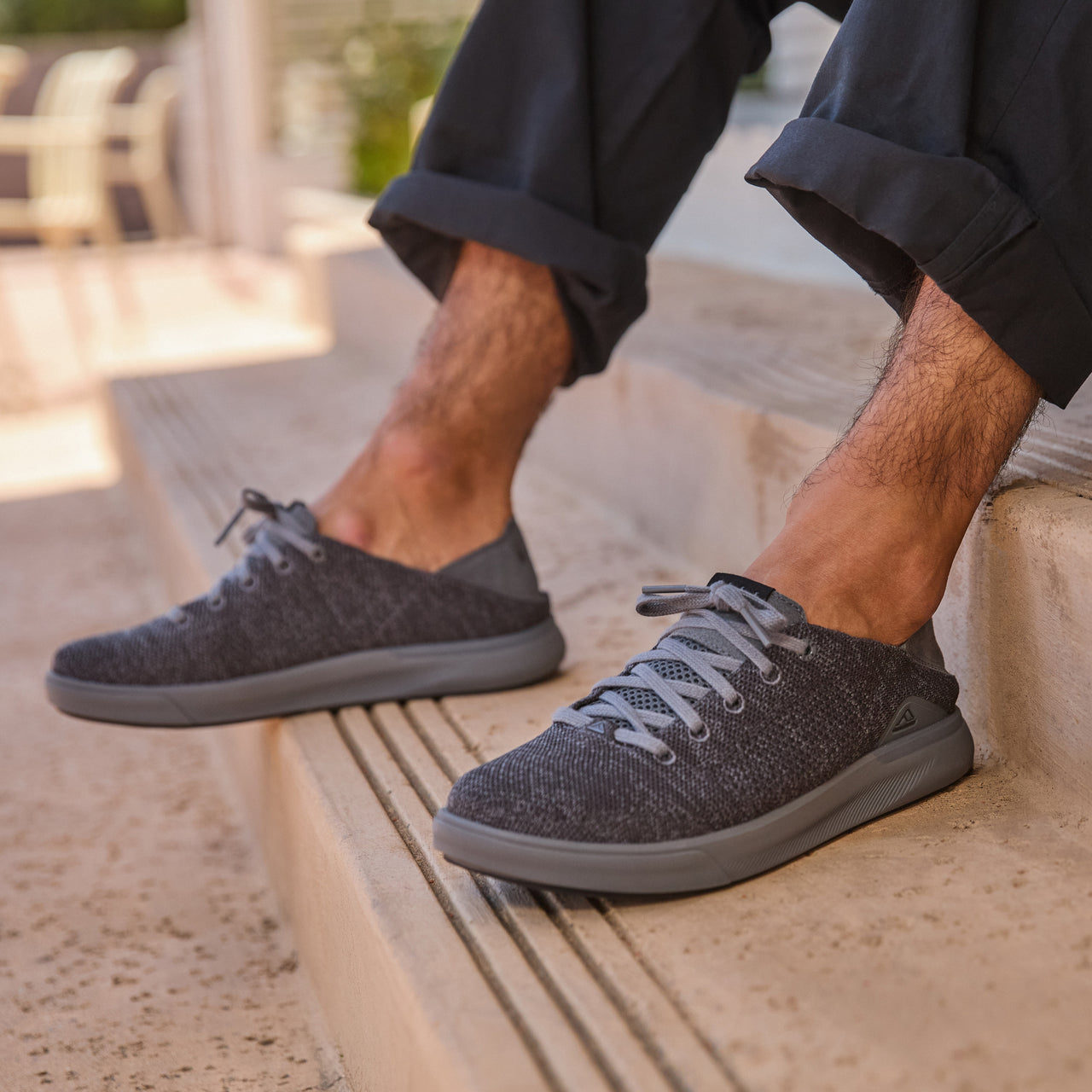 Neptune HT facing left on feet, men's black sneaker with REEFlex cushioning, anatomical arch support, lightweight mesh upper.