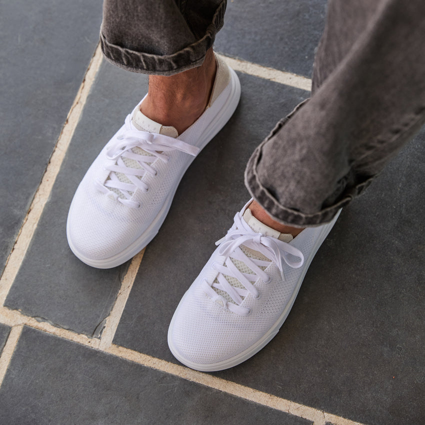 Top front view of white Neptune HT sneakers featuring cushioned, water-friendly design with arch support for all-day comfort.