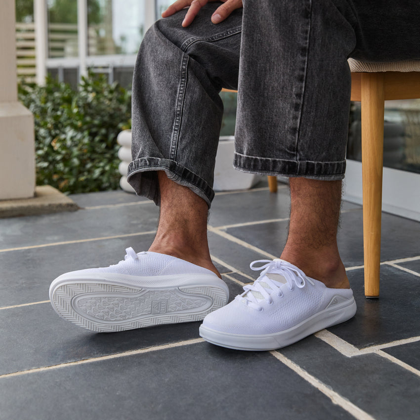 White Neptune HT shoes facing right, side and sole visible, beach-inspired with arch support and soft cushioning.