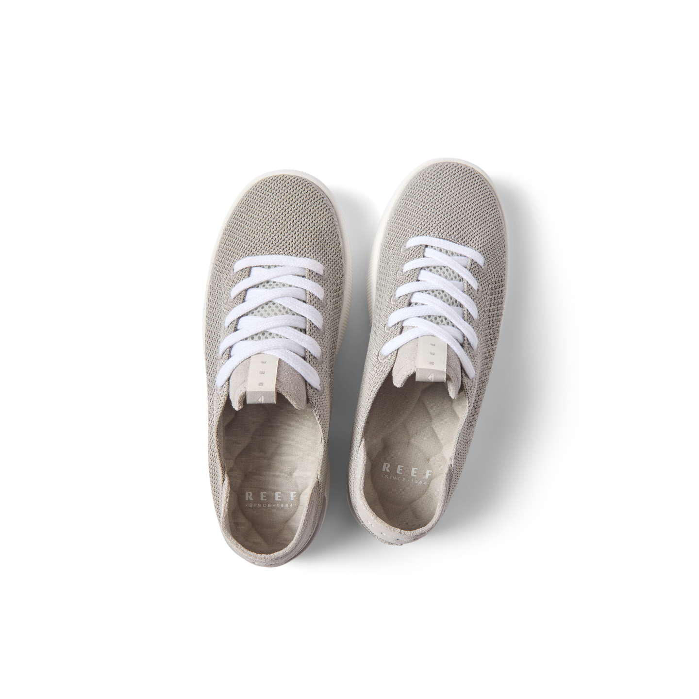 Top view of Reef Neptune women's lightweight sneakers in metallic silver with anatomical arch support and cushioning.