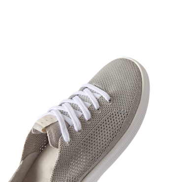 Reef Neptune women's sneaker facing forward, showing breathable knit upper with soft cushioning for beach comfort.