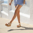 Woman wearing pale mauve Water Vista Higher sandals facing left, showing the front and side with soft cushioning and arch support