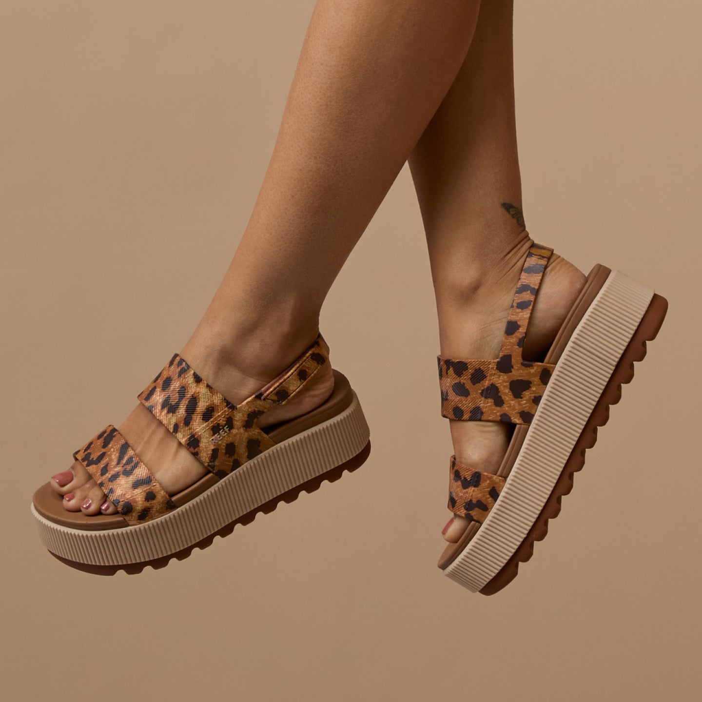 Side view of Women's Water Vista Higher sandals in leopard print with cushioned platform and anatomical arch support
