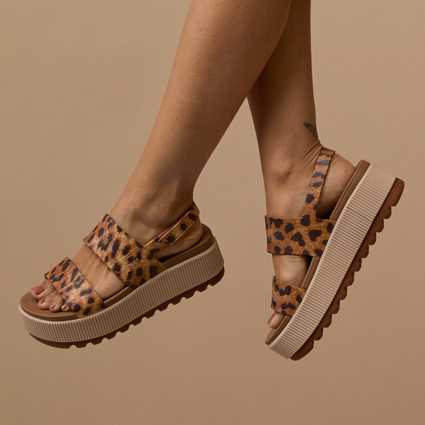 Side view of Women's Water Vista Higher sandals in leopard print with cushioned platform and anatomical arch support