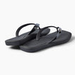 Solaye black flip flops facing right with sleek straps and cushioned footbeds for beach days
