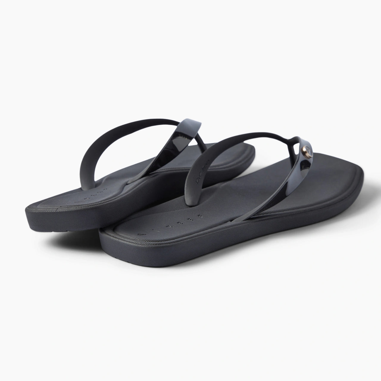 Solaye black flip flops facing right with sleek straps and cushioned footbeds for beach days