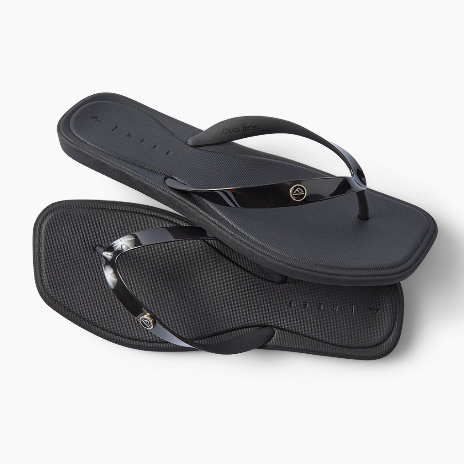 Solaye black water friendly flip flops facing right with sleek jelly straps and cushioned footbeds