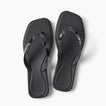 Solaye black square toe flip flops with glossy jelly straps toes facing upward