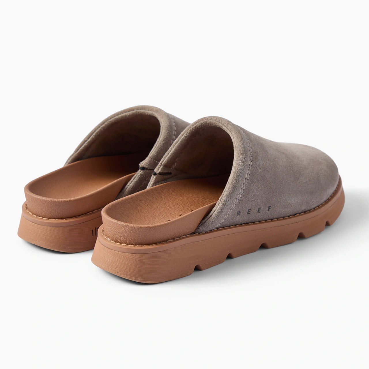 Vista Luxe Mariana gray suede clogs facing right in a rear three quarter view with open heel backs and closed toes