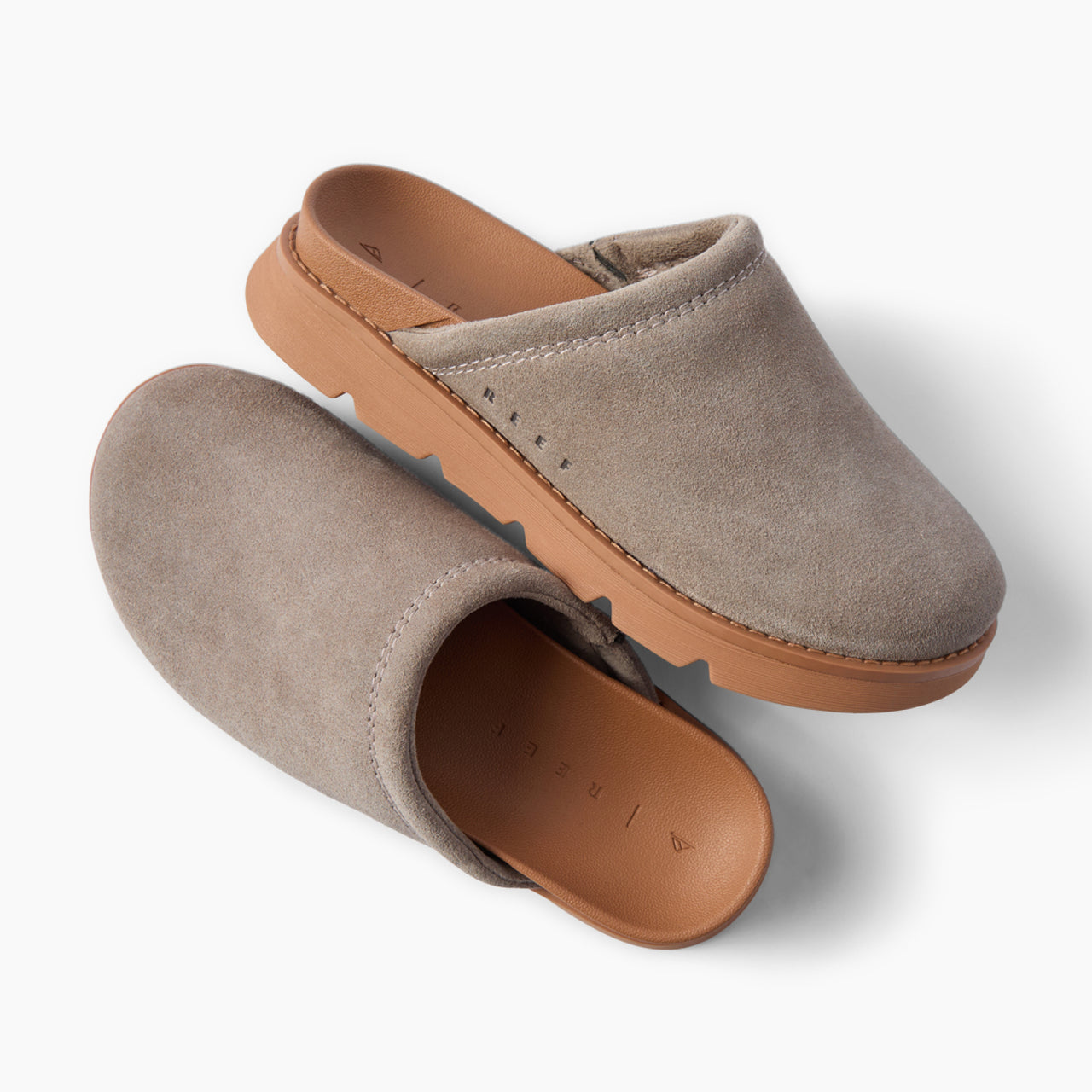 Vista Luxe Mariana suede clogs, one facing upper right and one lower left, with cushioned footbeds and arch support