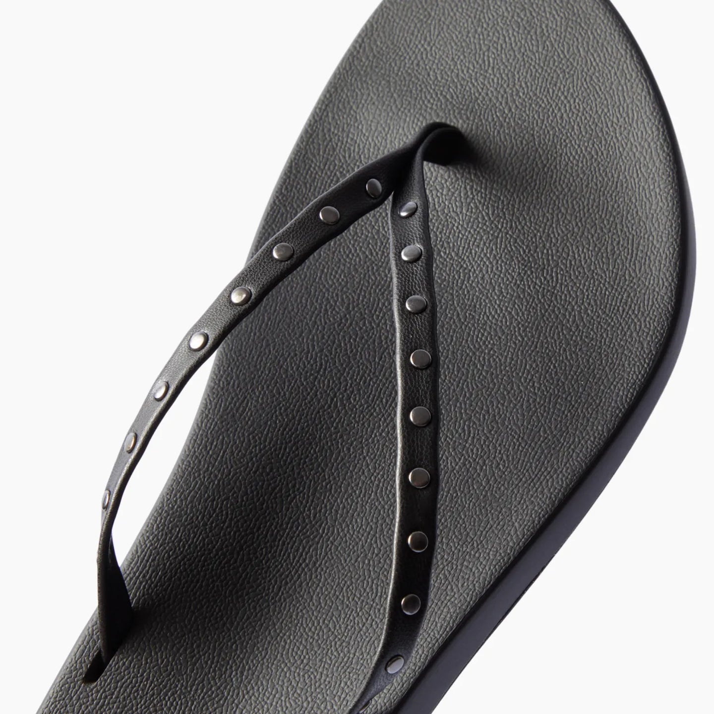 Top view of black Cushion Slim Studs sandal for women with studded straps and comfort cushioning for beachwear.