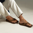 Phantom Lux men’s brown flip flops facing right, close-up of top and side showing cushioned, water-friendly design.