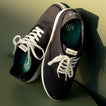 Pair of Neptune Lido navy canvas shoes for men, top-down view showing front and side with white laces and cushioned footbed.