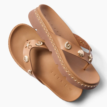 Vista Luxe Vivianahh tan sandals facing left with shell accents, ridged sole, and cushioned arch support for beach comfort.