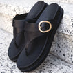 Vista Gabriella black slip-on sandals facing forward, showing buckle detail, arch support, and cushioned footbed close-up.