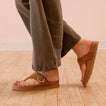 Vista Gabriella sandal facing right in a close-up side view showing buckle detail and suede strap on foot.