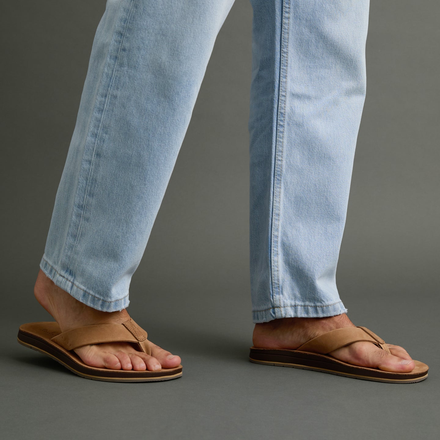 Ojai Classic tan sandals on feet facing right, showing soft-rebound cushioning and anatomical arch support for comfort.