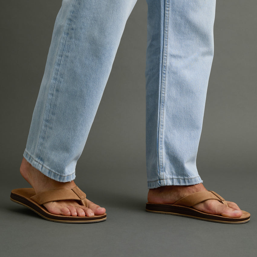 Ojai Classic tan sandals on feet facing right, showing soft-rebound cushioning and anatomical arch support for comfort.