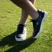 Onshore Pebble X Palm men's shoes facing right, showing top and side with floral pattern, on grass outdoors