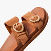 Vista Daphne slide sandal facing right, close-up of sculpted suede straps with gold adjustable buckles