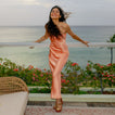 Woman wearing Vista Isabella sandals facing forward, showing comfort-focused design with ankle straps by the beach.
