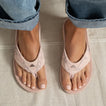 Fanning sandals facing forward, soft suede pink camo, close-up of top view showcasing arch support and comfort design.