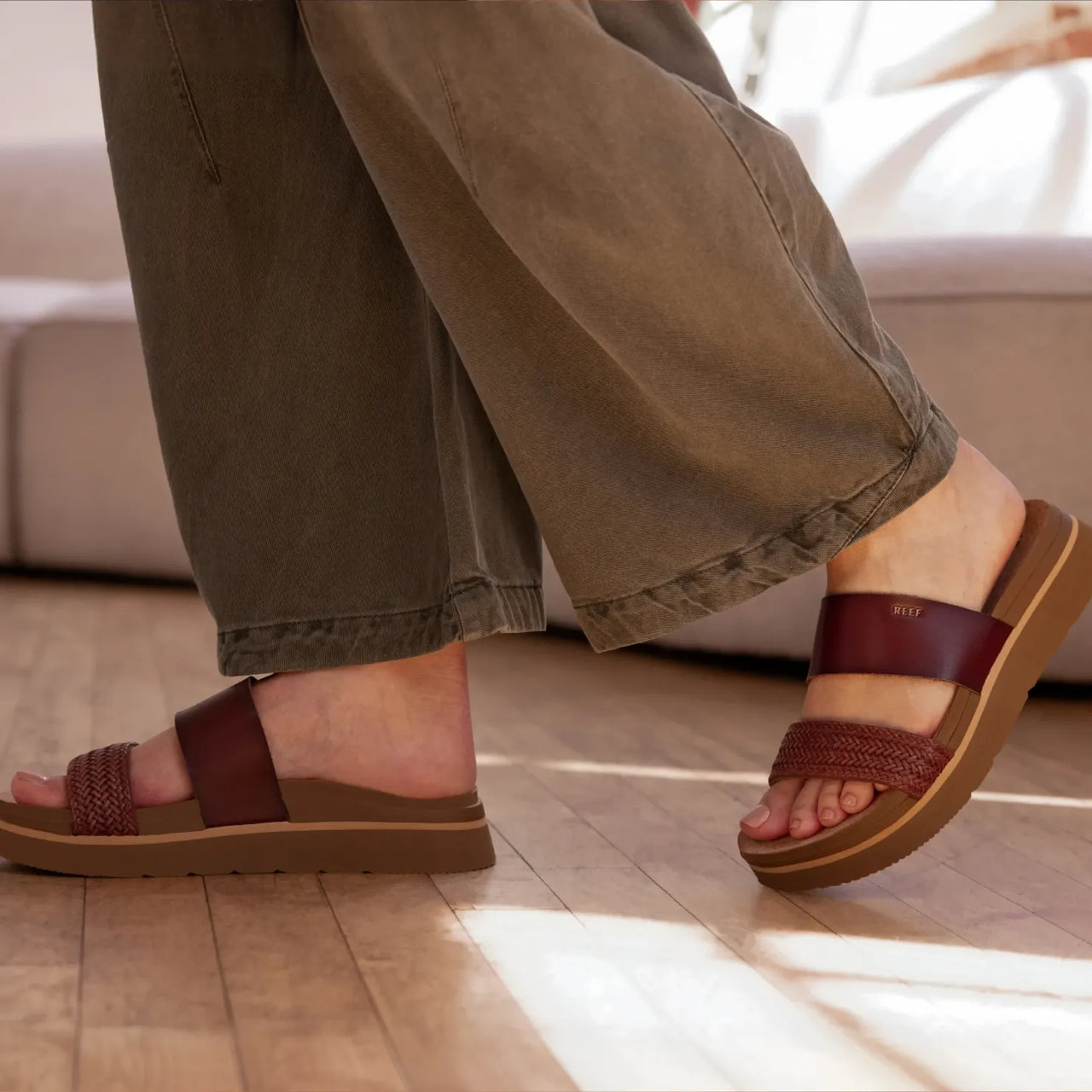 Vista Hi 2 women's sandals facing right, brown braided and smooth straps, lightweight with enhanced arch support, close-up on feet