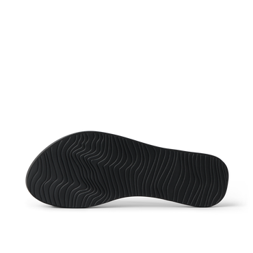 Bottom sole of Cushion Slim black women's footwear showing textured water-friendly rubber grip for beach comfort and durability