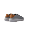 Atlantic men's sneaker showing rear and lateral sides in grey fabric with tan suede heel and white sole, beach-inspired comfort design