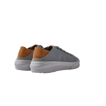 Atlantic men's sneaker showing rear and lateral sides in grey fabric with tan suede heel and white sole, beach-inspired comfort design