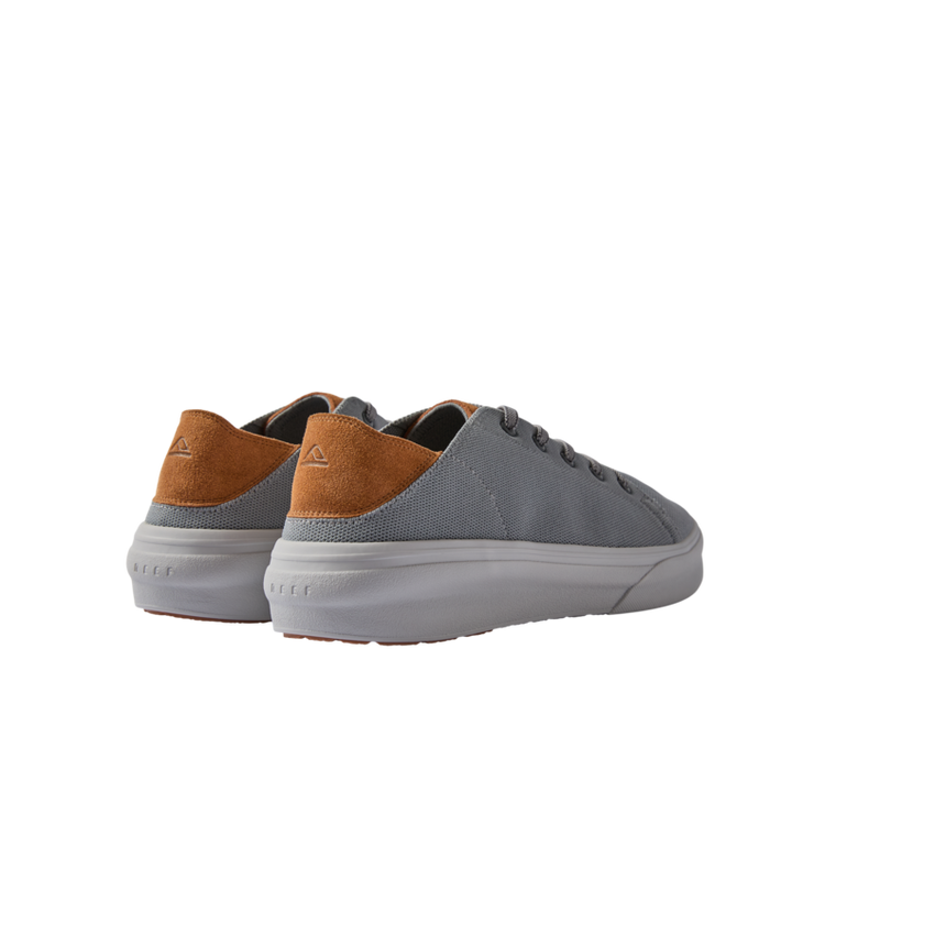 Atlantic men's sneaker showing rear and lateral sides in grey fabric with tan suede heel and white sole, beach-inspired comfort design