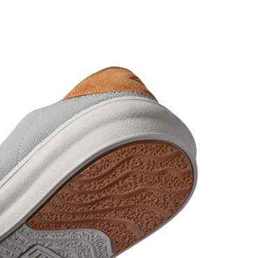 Atlantic men's shoe close-up of sole and heel facing upward with textured outsole, extra cushioning, and arch support design.