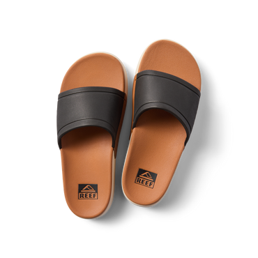Top view of Sydnee Cutback Low black and tan slides for women, featuring water-friendly design and soft footbed comfort.