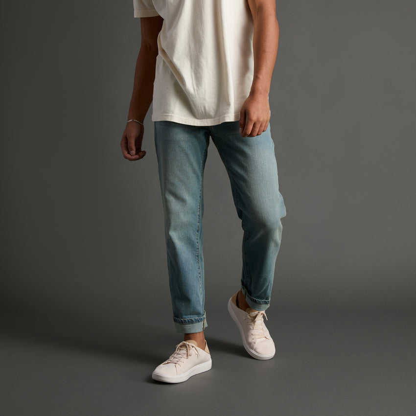 Men’s Terramar sneakers facing left, white knit upper with soft cushioning and anatomical arch support.