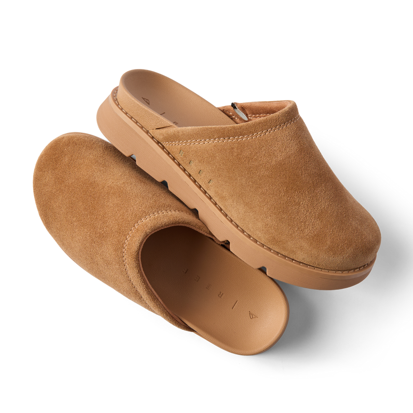 Vista Luxe Mariana suede clogs, one facing right and one facing lower left, with cushioned footbeds and arch support