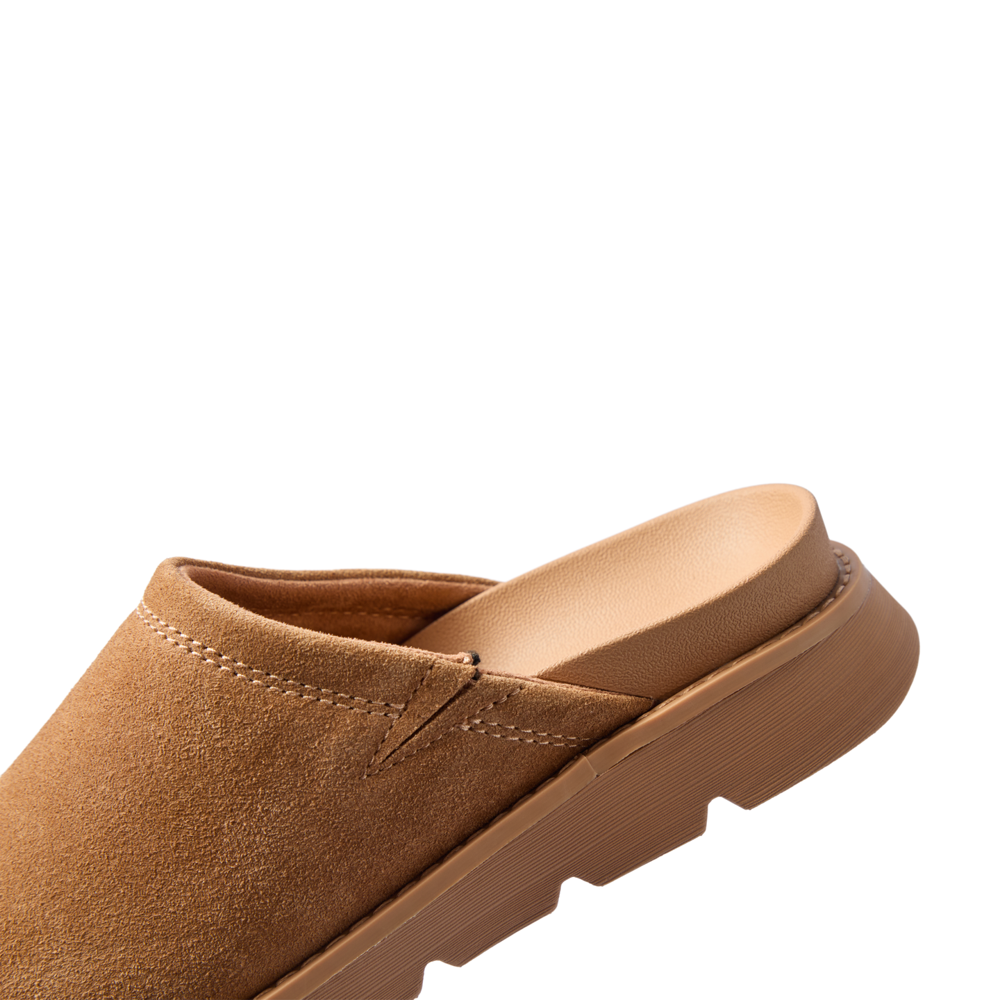 Vista Luxe Mariana suede clog facing left in close up showing the closed toe and cushioned footbed